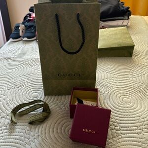Gucci accessory box and shopping bag